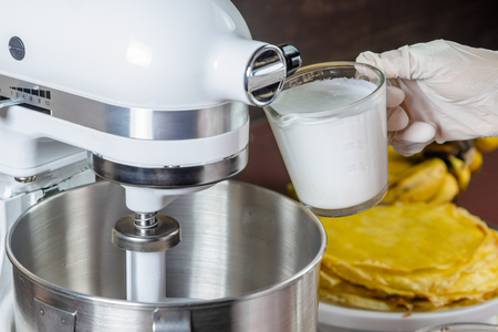 Mixer with whipping cream for make cakeの写真素材