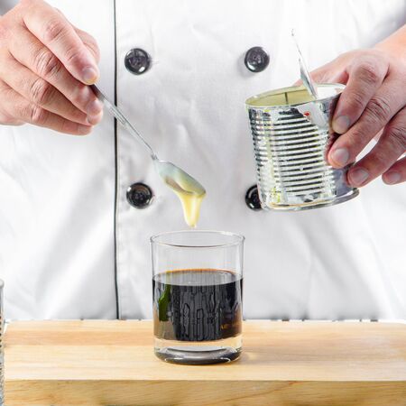 chef making thai ice milk teaの写真素材