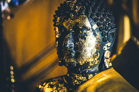 old golden Buddha Statue in thailandの写真素材