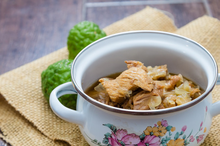 thai cuisine, sweet pork with Bergamot in pot on woodenの写真素材