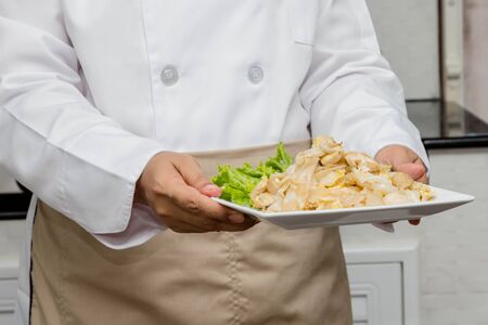 chef making stir-fried Noodles with porkの写真素材