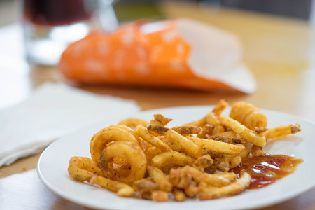 Fried Onion Rings and frenfried in plateの写真素材