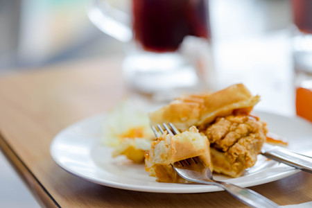 Waffles sandwich with fried chicken in white plateの写真素材