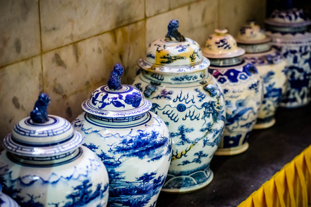 close up ancient vase placed on the table.の写真素材