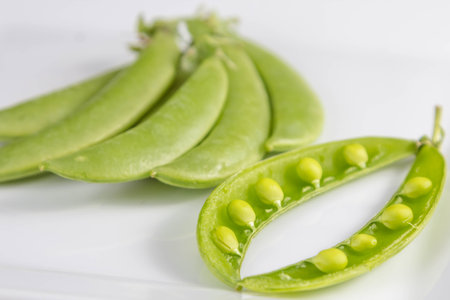 Freshly snow peas on wooden Cutting Board