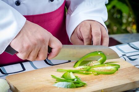 Sliced Green Bell Pepper On Wooden Boardの写真素材