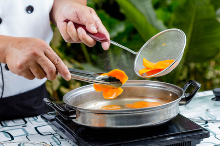 chef boiled carrots in potの写真素材