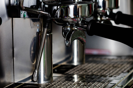 women hand making coffee in coffee machineの写真素材