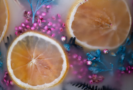 Large aromatic decorative candle with a herbarium of dried herbs and fruits inside