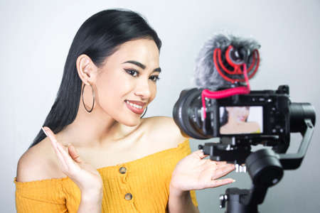 Vlogger concept: Beauty guru recording a make up tutorial video.の写真素材