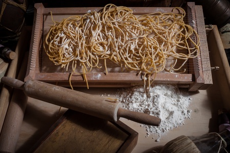 Homemade egg pasta with rolling pinの写真素材
