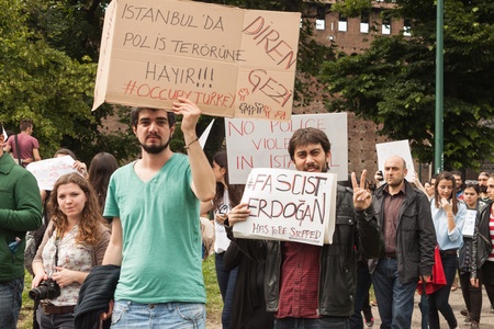 MILAN, ITALY - JUNE 1: Turkish people protest in defence of democracy and against prime minister Erdogan for the violent attacks by riot police at Gezi Park (Istanbul) in Milan JUNE 1, 2013のeditorial素材