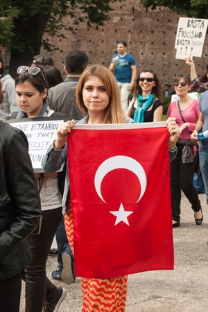 MILAN, ITALY - JUNE 1: Turkish people protest in defence of democracy and against prime minister Erdogan for the violent attacks by riot police at Gezi Park (Istanbul) in Milan JUNE 1, 2013のeditorial素材
