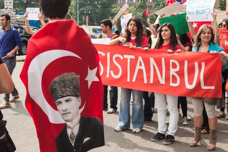 MILAN, ITALY - JUNE 1: Turkish people protest in defence of democracy and against prime minister Erdogan for the violent attacks by riot police at Gezi Park (Istanbul) in Milan JUNE 1, 2013のeditorial素材