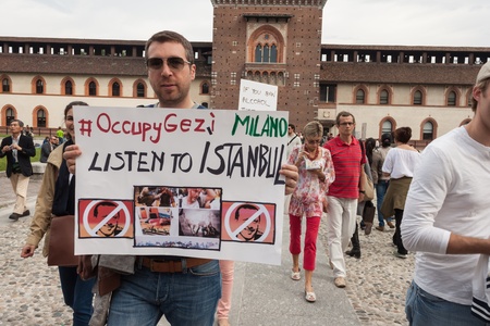 MILAN, ITALY - JUNE 1: Turkish people protest in defence of democracy and against prime minister Erdogan for the violent attacks by riot police at Gezi Park (Istanbul) in Milan JUNE 1, 2013のeditorial素材