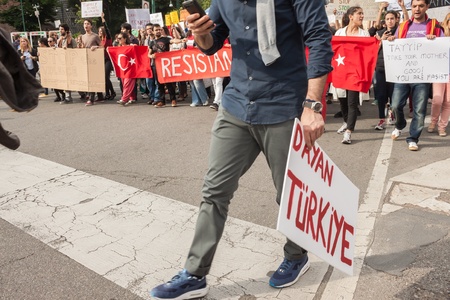 MILAN, ITALY - JUNE 1: Turkish people protest in defence of democracy and against prime minister Erdogan for the violent attacks by riot police at Gezi Park (Istanbul) in Milan JUNE 1, 2013のeditorial素材