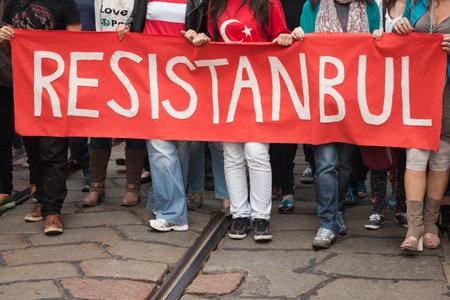 MILAN, ITALY - JUNE 1: Turkish people protest in defence of democracy and against prime minister Erdogan for the violent attacks by riot police at Gezi Park (Istanbul) in Milan JUNE 1, 2013のeditorial素材