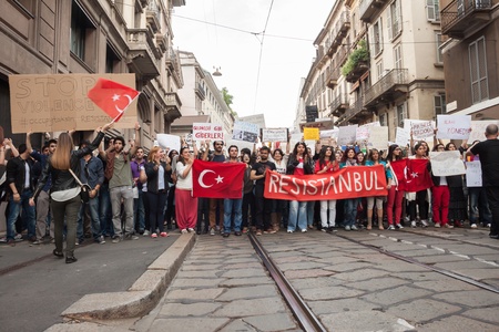 MILAN, ITALY - JUNE 1: Turkish people protest in defence of democracy and against prime minister Erdogan for the violent attacks by riot police at Gezi Park (Istanbul) in Milan JUNE 1, 2013のeditorial素材