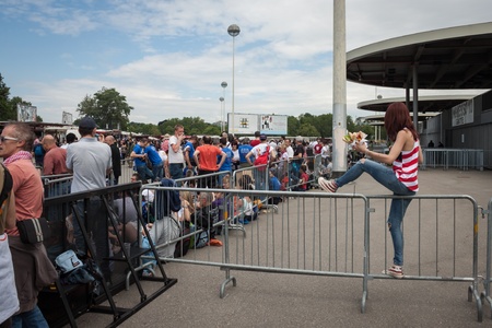 MILAN, ITALY - JUNE 3: Thousands of fans gather outside the stadium waiting for the gates to open at Bruce Springsteen world tour in Milan JUNE 3, 2013のeditorial素材