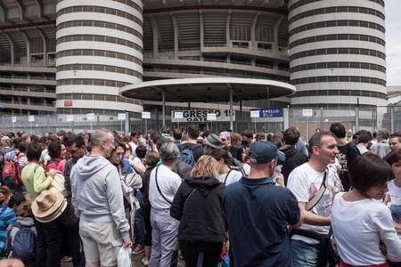 MILAN, ITALY - JUNE 3: Thousands of fans gather outside the stadium waiting for the gates to open at Bruce Springsteen world tour in Milan JUNE 3, 2013のeditorial素材