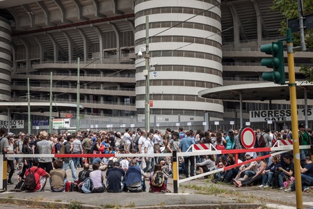 MILAN, ITALY - JUNE 3: Thousands of fans gather outside the stadium waiting for the gates to open at Bruce Springsteen world tour in Milan JUNE 3, 2013のeditorial素材