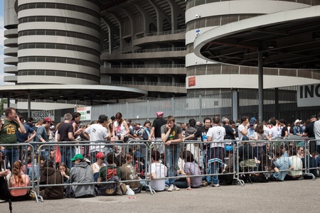 MILAN, ITALY - JUNE 3: Thousands of fans gather outside the stadium waiting for the gates to open at Bruce Springsteen world tour in Milan JUNE 3, 2013のeditorial素材