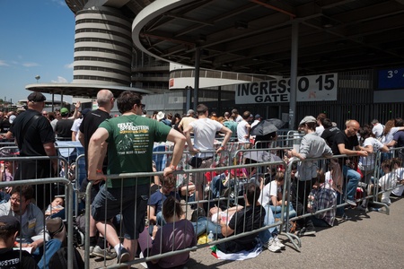 MILAN, ITALY - JUNE 3: Thousands of fans gather outside the stadium waiting for the gates to open at Bruce Springsteen world tour in Milan JUNE 3, 2013のeditorial素材