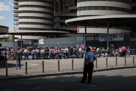 MILAN, ITALY - JUNE 3: Thousands of fans gather outside the stadium waiting for the gates to open at Bruce Springsteen world tour in Milan JUNE 3, 2013のeditorial素材