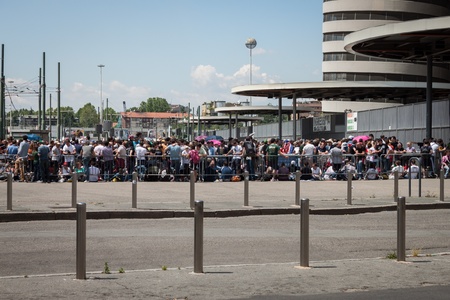MILAN, ITALY - JUNE 3: Thousands of fans gather outside the stadium waiting for the gates to open at Bruce Springsteen world tour in Milan JUNE 3, 2013のeditorial素材