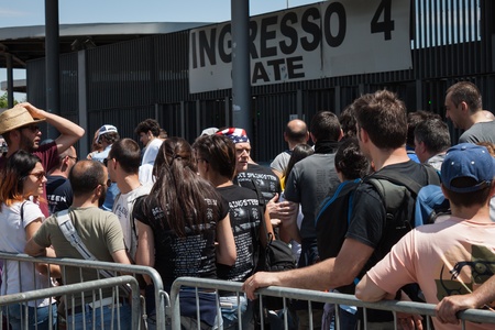 MILAN, ITALY - JUNE 3: Thousands of fans gather outside the stadium waiting for the gates to open at Bruce Springsteen world tour in Milan JUNE 3, 2013のeditorial素材