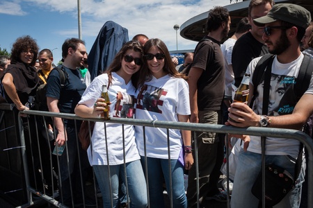 MILAN, ITALY - JUNE 3: Thousands of fans gather outside the stadium waiting for the gates to open at Bruce Springsteen world tour in Milan JUNE 3, 2013のeditorial素材