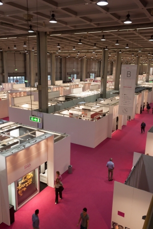 MILAN, ITALY - JUNE 21: People visit SposaItalia exhibition, international presentation of bridal and formal wear according to Italian style in Milan on JUNE 21, 2013.のeditorial素材