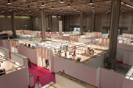 MILAN, ITALY - JUNE 21: People visit SposaItalia exhibition, international presentation of bridal and formal wear according to Italian style in Milan on JUNE 21, 2013.のeditorial素材