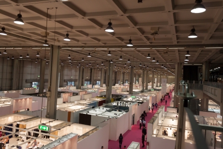 MILAN, ITALY - JUNE 21: People visit SposaItalia exhibition, international presentation of bridal and formal wear according to Italian style in Milan on JUNE 21, 2013.のeditorial素材