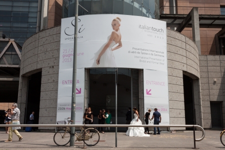 MILAN, ITALY - JUNE 21: People visit SposaItalia exhibition, international presentation of bridal and formal wear according to Italian style in Milan on JUNE 21, 2013.のeditorial素材