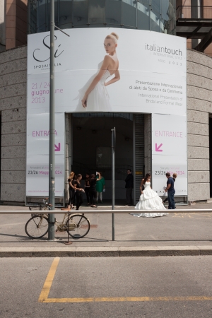 MILAN, ITALY - JUNE 21: People visit SposaItalia exhibition, international presentation of bridal and formal wear according to Italian style in Milan on JUNE 21, 2013.のeditorial素材