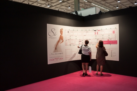 MILAN, ITALY - JUNE 21: People visit SposaItalia exhibition, international presentation of bridal and formal wear according to Italian style in Milan on JUNE 21, 2013.のeditorial素材
