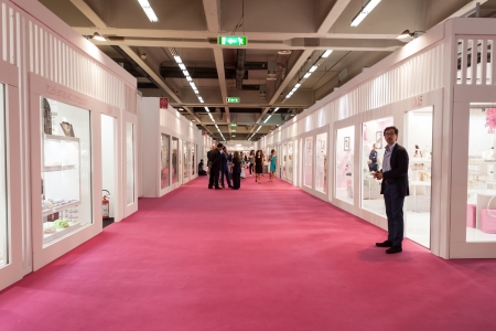MILAN, ITALY - JUNE 21: People visit SposaItalia exhibition, international presentation of bridal and formal wear according to Italian style in Milan on JUNE 21, 2013.のeditorial素材