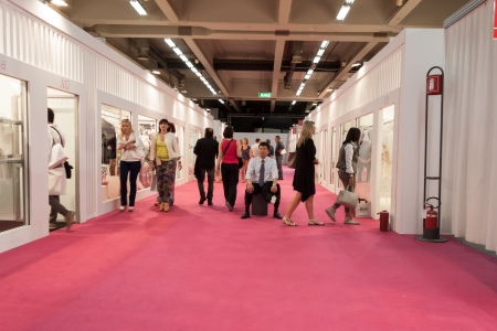 MILAN, ITALY - JUNE 21: People visit SposaItalia exhibition, international presentation of bridal and formal wear according to Italian style in Milan on JUNE 21, 2013.のeditorial素材