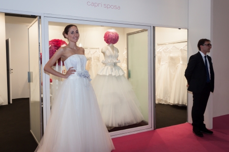 MILAN, ITALY - JUNE 21: People visit SposaItalia exhibition, international presentation of bridal and formal wear according to Italian style in Milan on JUNE 21, 2013.のeditorial素材