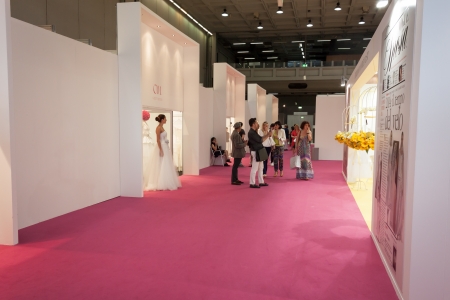 MILAN, ITALY - JUNE 21: People visit SposaItalia exhibition, international presentation of bridal and formal wear according to Italian style in Milan on JUNE 21, 2013.のeditorial素材