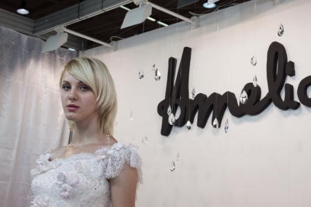 MILAN, ITALY - JUNE 21: People visit SposaItalia exhibition, international presentation of bridal and formal wear according to Italian style in Milan on JUNE 21, 2013.のeditorial素材
