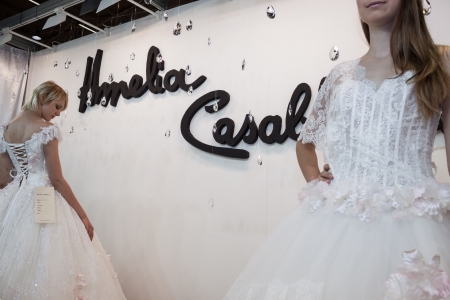MILAN, ITALY - JUNE 21: People visit SposaItalia exhibition, international presentation of bridal and formal wear according to Italian style in Milan on JUNE 21, 2013.のeditorial素材