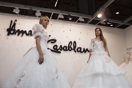 MILAN, ITALY - JUNE 21: People visit SposaItalia exhibition, international presentation of bridal and formal wear according to Italian style in Milan on JUNE 21, 2013.のeditorial素材
