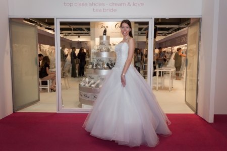 MILAN, ITALY - JUNE 21: People visit SposaItalia exhibition, international presentation of bridal and formal wear according to Italian style in Milan on JUNE 21, 2013.のeditorial素材