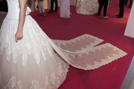 MILAN, ITALY - JUNE 21: People visit SposaItalia exhibition, international presentation of bridal and formal wear according to Italian style in Milan on JUNE 21, 2013.のeditorial素材