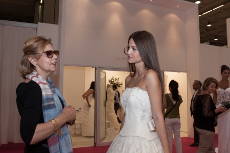 MILAN, ITALY - JUNE 21: People visit SposaItalia exhibition, international presentation of bridal and formal wear according to Italian style in Milan on JUNE 21, 2013.のeditorial素材