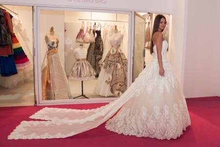 MILAN, ITALY - JUNE 21: People visit SposaItalia exhibition, international presentation of bridal and formal wear according to Italian style in Milan on JUNE 21, 2013.のeditorial素材
