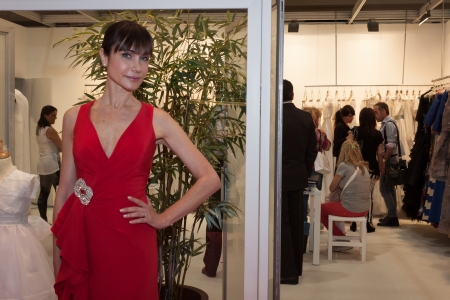 MILAN, ITALY - JUNE 21: People visit SposaItalia exhibition, international presentation of bridal and formal wear according to Italian style in Milan on JUNE 21, 2013.のeditorial素材