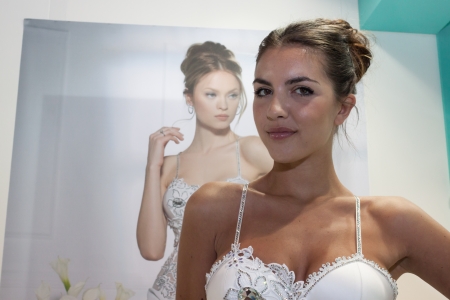 MILAN, ITALY - JUNE 21: People visit SposaItalia exhibition, international presentation of bridal and formal wear according to Italian style in Milan on JUNE 21, 2013.のeditorial素材